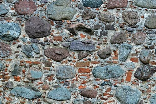 Fototapeta Naklejka Na Ścianę i Meble -  Brick stones and wood as background wallpapers and textures for smartphones and tablets. Photos were taken in 2021 in Podlasie and Masuria in Poland.