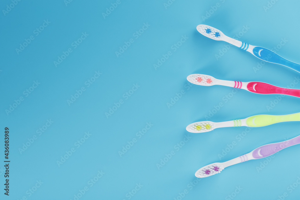 Four toothbrushes on a blue background for the whole family. Four toothbrushes on a blue background for the whole family.