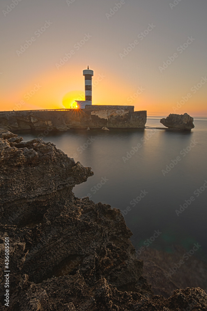 sunrise behind the lighthouse in Mallorca