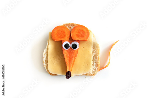 Food art creative concepts. Cute mouse made of cheese, bread and carrots vegetables isolated on a white background.
