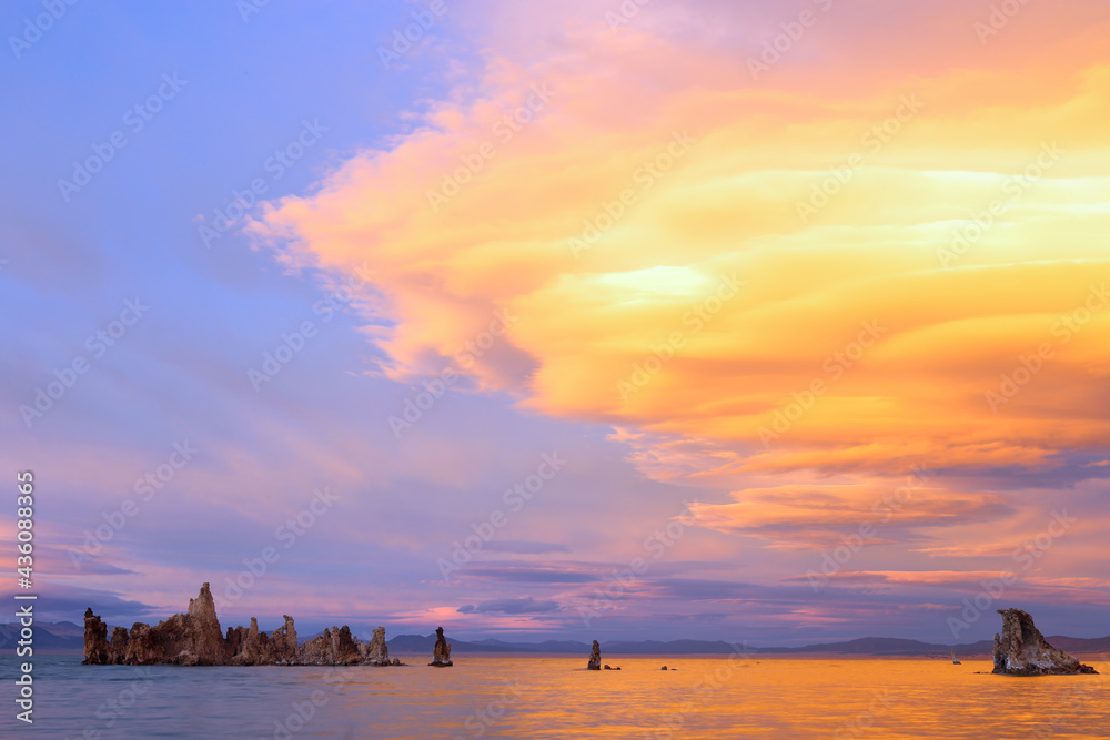 Fantastic colors over Mono Lake with lenticular clouds moving over it at a twilight