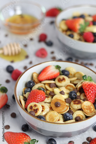 Pancake cereal with fruit, honey and chocolate chips 