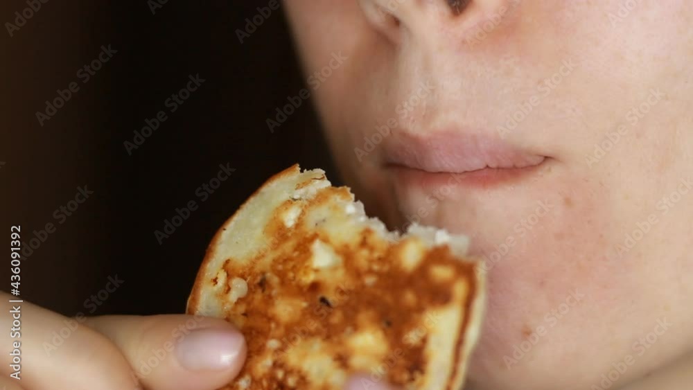 Closeup woman eating cheesecakes for breakfast. Food and diet concept. Closeup woman eating cheesecakes for breakfast. Food and diet concept.