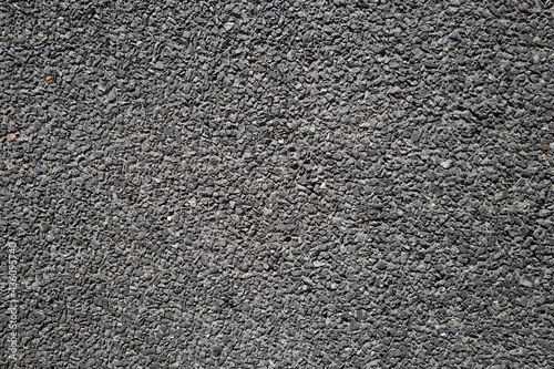 Light Grey asphalt surface with small pebble texture background.