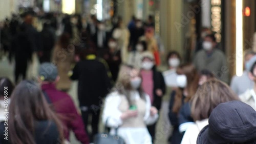 Wallpaper Mural OSAKA, JAPAN - APRIL 2021 : Crowd of people wearing surgical masks to protect from Coronavirus (COVID-19) at Namba, Shinsaibashi shopping street. Slow motion shot. Torontodigital.ca