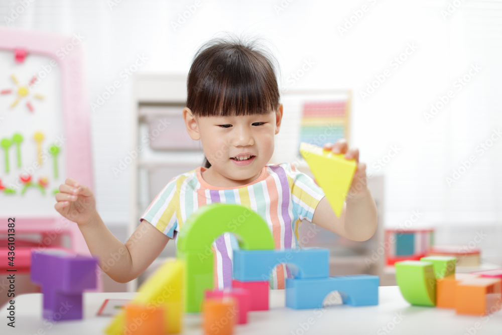 young girl playing creative blocks at home young girl playing creative blocks at home