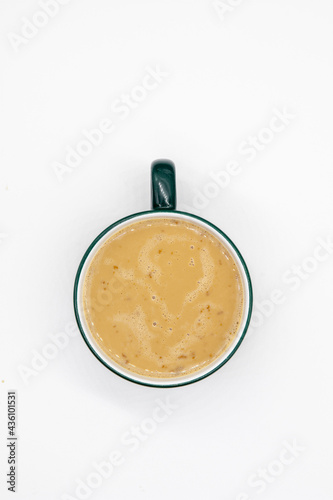 conceptual photo of a cup of coffee on white background, top view 