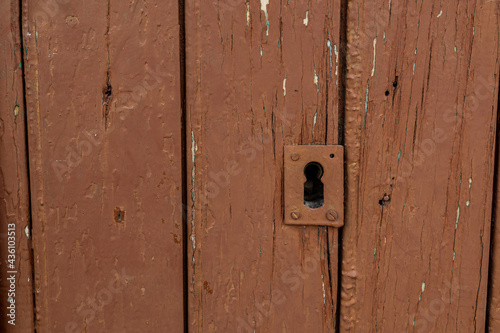  old vintage brown wooden door with keyhole © Joanna Redesiuk