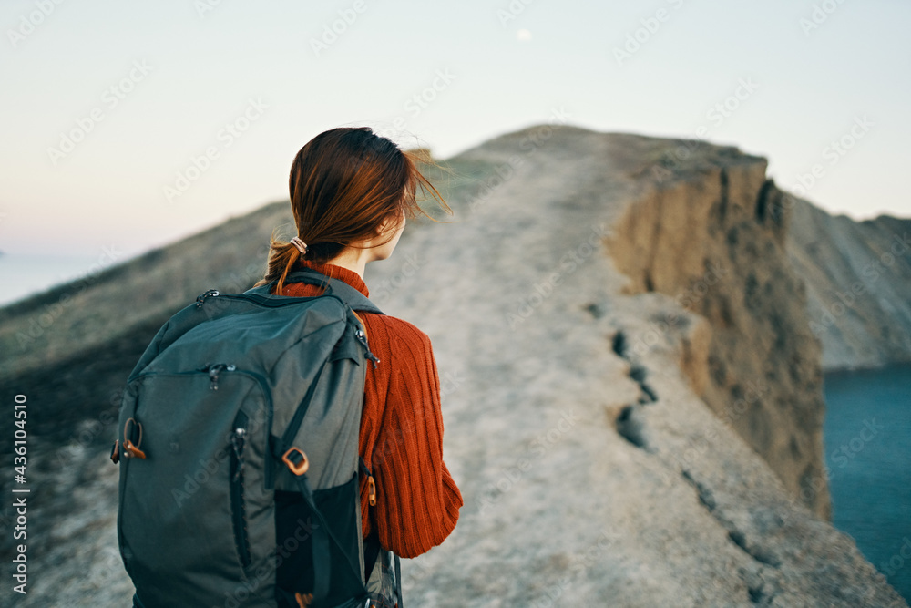 high mountains hills and happy traveler in nature near the sea