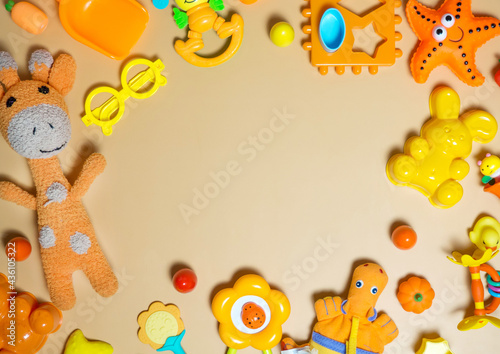 Children's children's toys frame. A set of colorful orange toys on an orange background. Top view, flat layout © Максим