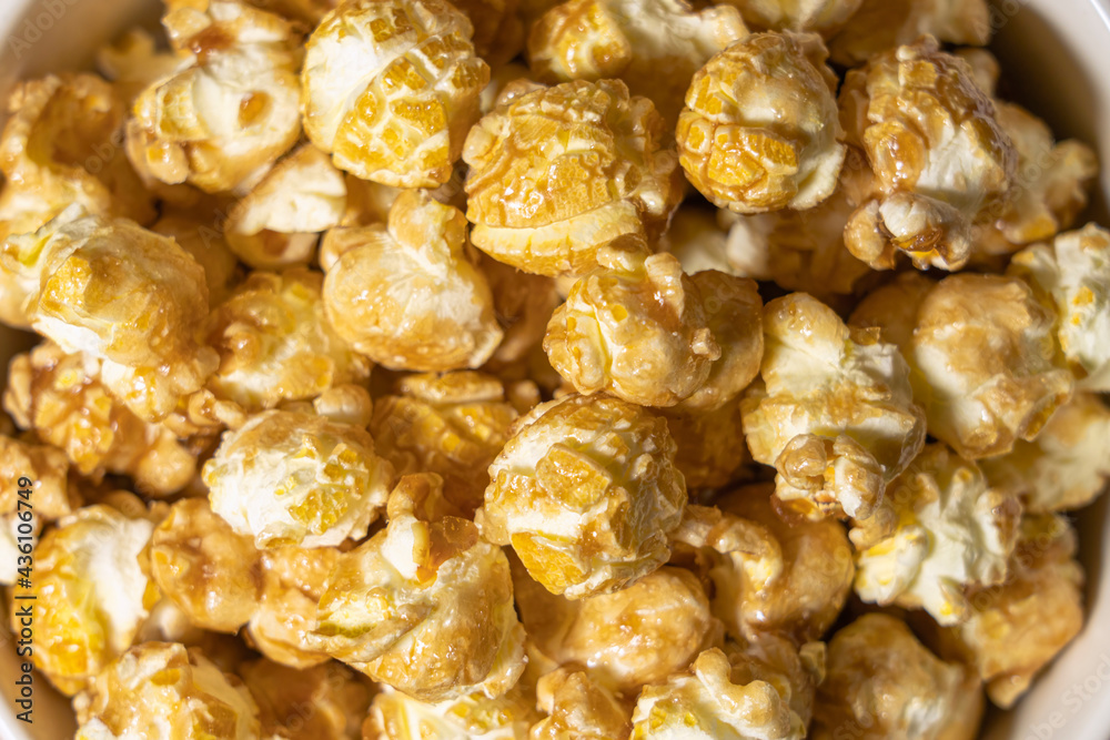 popcorn in caramel top view close - up as background popcorn in caramel top view close - up as background