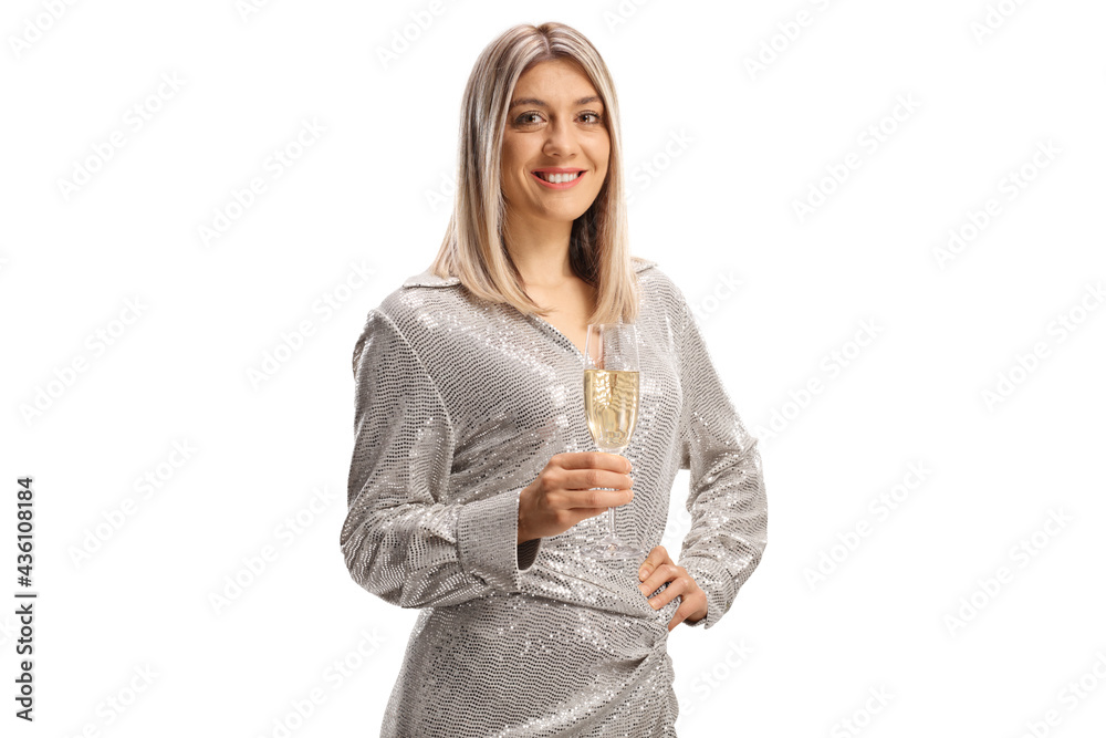 Attractive young woman in elegant clothes holding a glass of sparkling wine and smiling Attractive young woman in elegant clothes holding a glass of sparkling wine and smiling