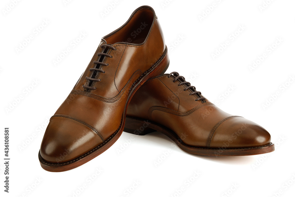 Men's brown oxford fashion shoes isolated on a white background.