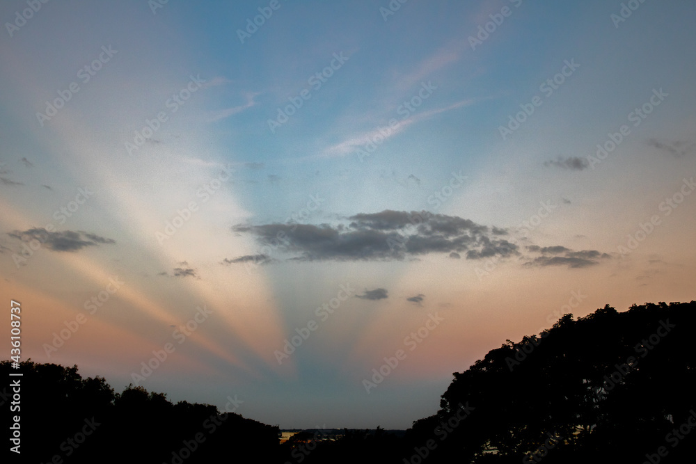 Obraz premium Twilight with sky colored by the rays of the sun in blue and yellow