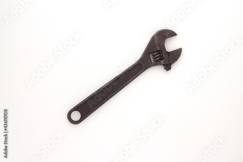 Old rusty Adjustable Wrench on white background. © bt1976