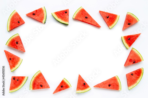 Frame made of slices of watermelon on white.