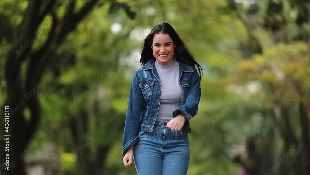 Woman celebrating news dancing in happiness Woman celebrating news dancing in happiness