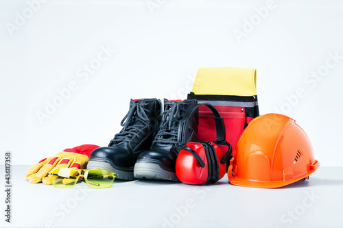 Personal protective equipment on light grey background. Safety work concept.