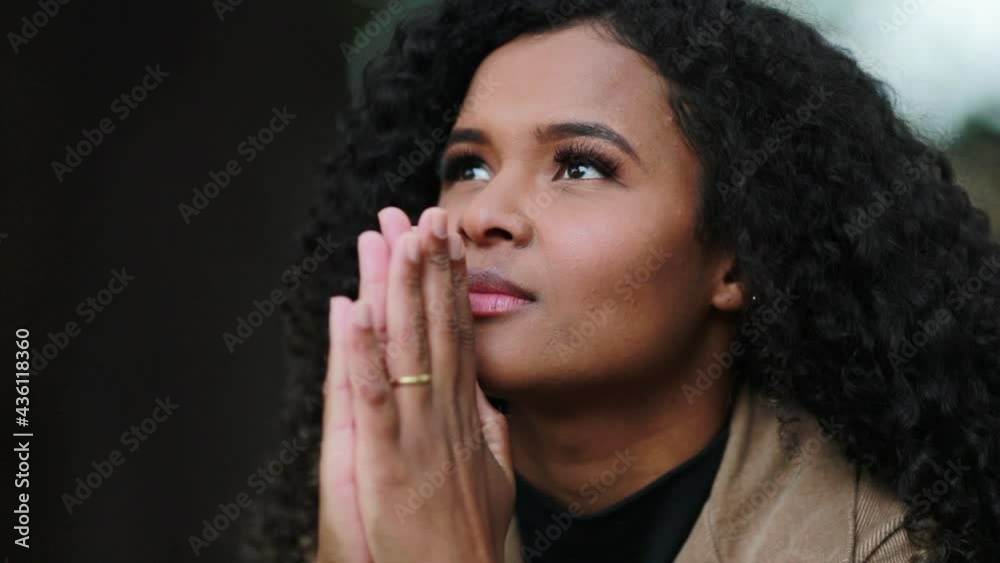 Black woman face praying to God. Hopeful Brazilian girl Black woman face praying to God. Hopeful Brazilian girl