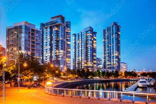 Apartment condominium towers in Vancouver's Yaletown neighbourhood at dusk.