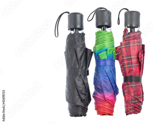 White background. Three umbrellas of different styles.