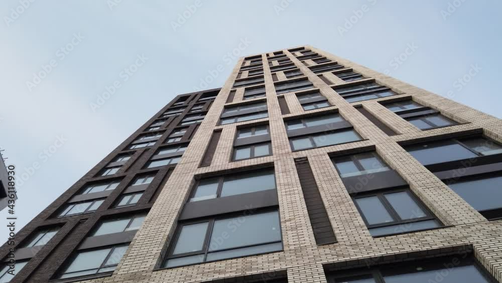 Exterior of a high-rise multi-story apartment building - facade, windows. Exterior of a high-rise multi-story apartment building - facade, windows.