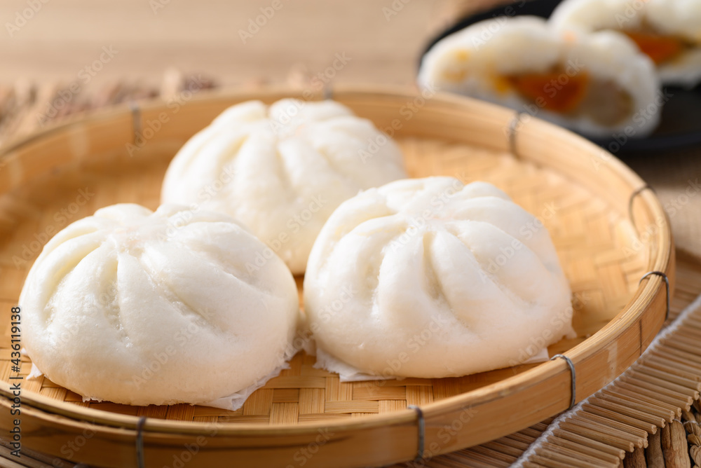 Steamed bun stuffed with minced pork on bamboo basket, Asian food Steamed bun stuffed with minced pork on bamboo basket, Asian food
