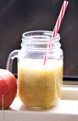 jar of healthy smoothie and apple
