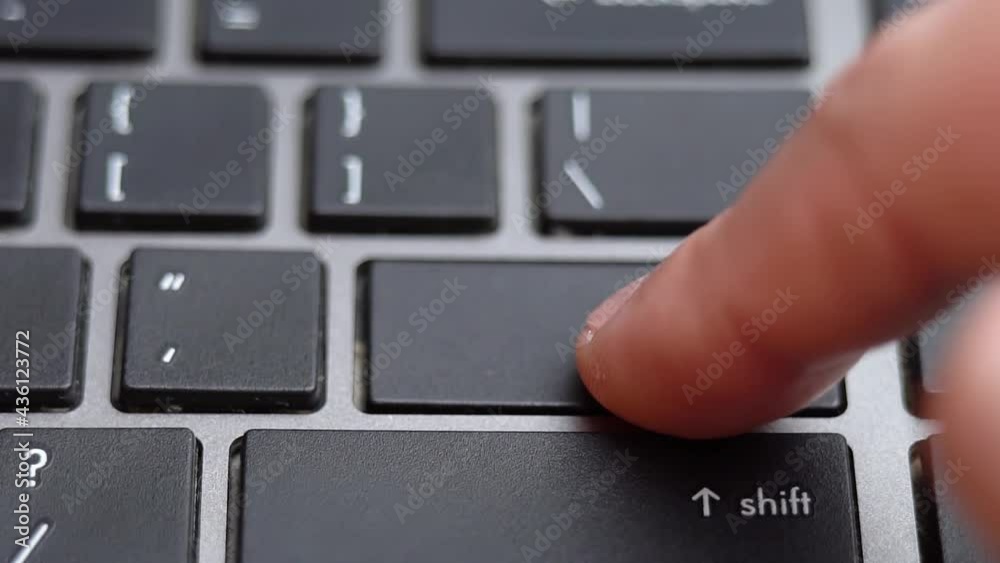 Enter button long pressing a lot of times on keyboard, laptop keyboard close up