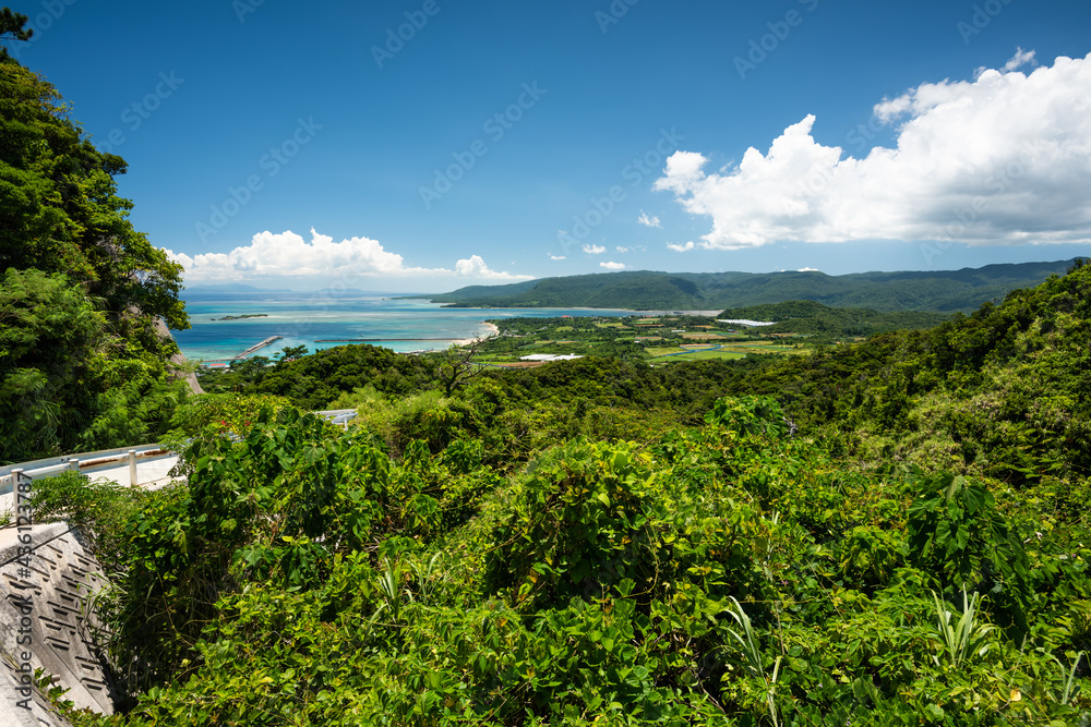 Top view of Uehara port and green mountains of Iriomote island.