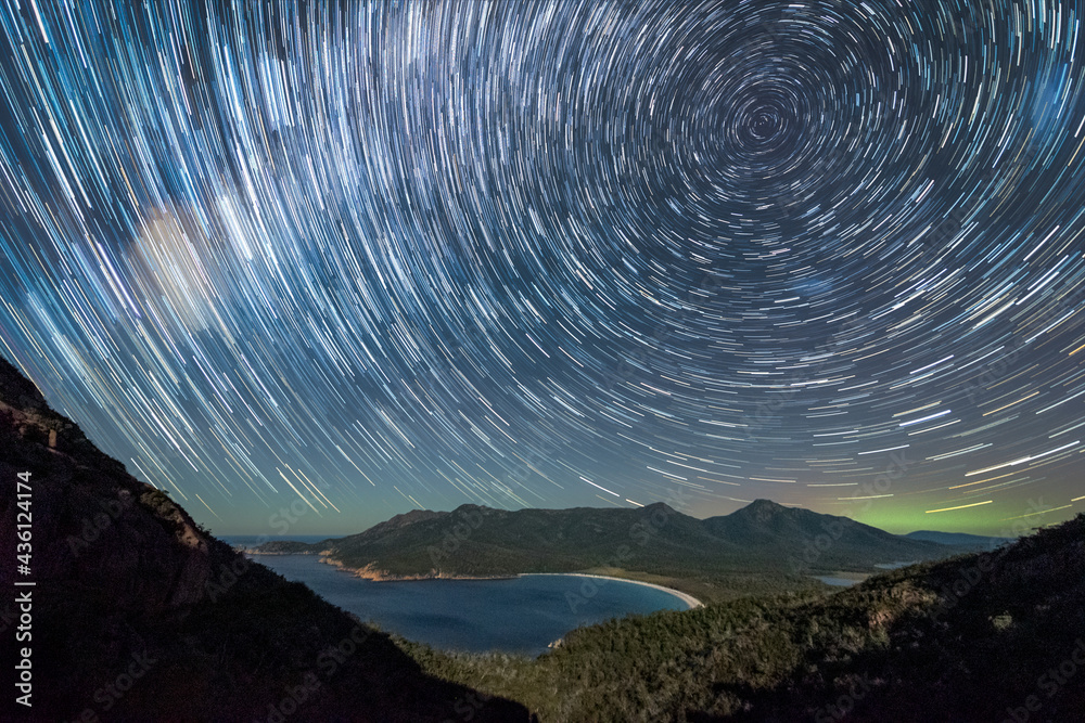 Fototapeta premium Star Trails and aurora over Wineglass Bay, Tasmania