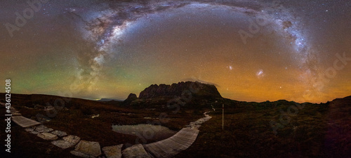 Milky Way panorama over Cradle Mountain Summit and the Overland Track with crazy red airglow in the sky