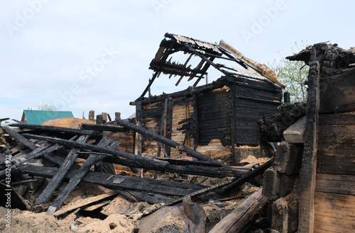 View of a deserted run down wooden village house after a fire