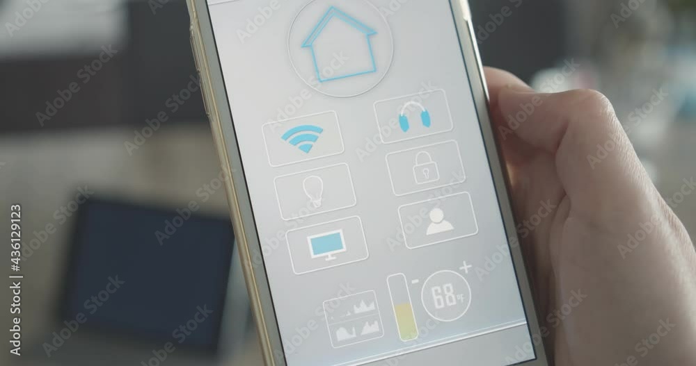 Woman holds smartphone with smart home app all in one functions to control temperature, light, entertainment, security systems