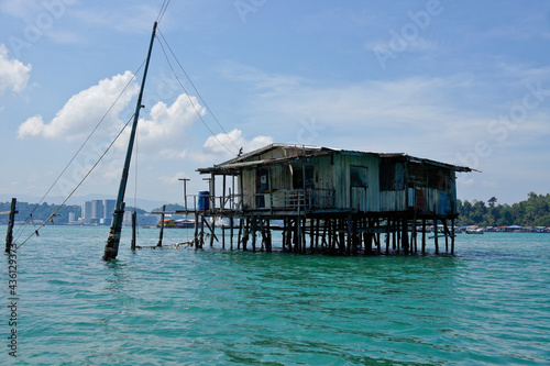 Fototapeta Naklejka Na Ścianę i Meble -  Dwelling (with electricity) built on stilts in South China Sea near Kota Kinabalu, Sabah (Borneo), Malaysia