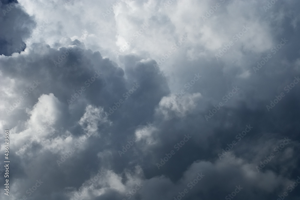 Evening cumulus cloud and blue sky background before sunset. A fluctuation weather make a dreamy and imaginative cloudscape. Wild blue sky in rainy season. Evening cumulus cloud and blue sky background before sunset. A fluctuation weather make a dreamy and imaginative cloudscape. Wild blue sky in rainy season.