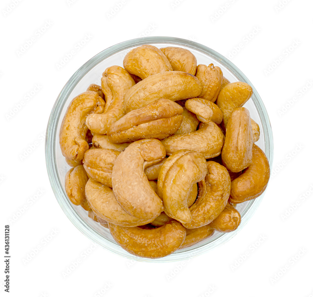 fried cashew nuts in glass bowl isolated on white background ,include clipping path fried cashew nuts in glass bowl isolated on white background ,include clipping path