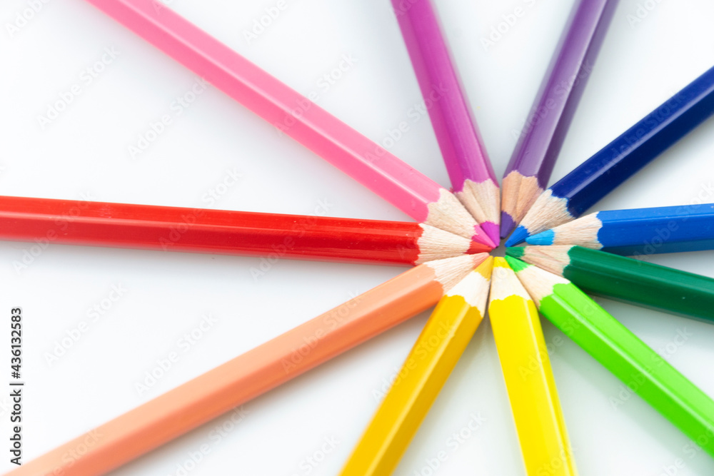 Coloured Pencils on White Paper Background Coloured Pencils on White Paper Background