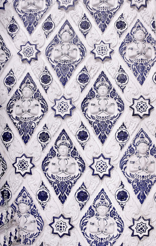 Slika na platnu Ancient blue and white diamond repeating ceramic tile pattern with cherub prayin
