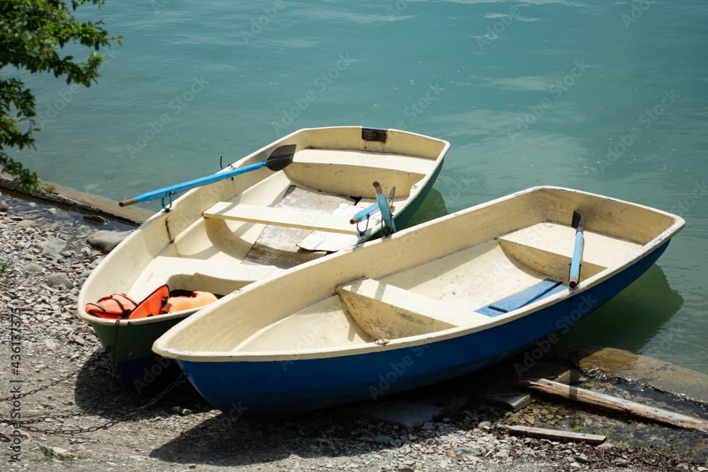 Two small boats on the lake.