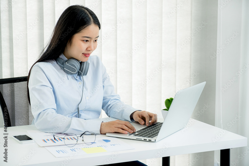 Businesswoman analysis the chart and meeting Video Conferencing with laptop at the home office for setting challenging business goals And planning to achieve the new target Businesswoman analysis the chart and meeting Video Conferencing with laptop at the home office for setting challenging business goals And planning to achieve the new target