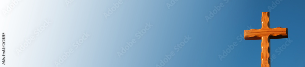 Religion banner. Cross on blue sky background.Christian banner. Christianity and Catholicism religion . Wooden cross on blue background.Jesus Christ cross. Religion banner. Cross on blue sky background.Christian banner. Christianity and Catholicism religion . Wooden cross on blue background.Jesus Christ cross.