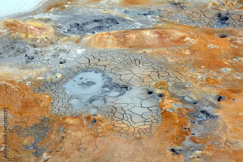 colorful boiling mud pools at krafla volcanic crater neart lake myvatn, iceland