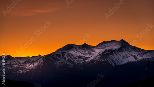 Sunrise over the Garibaldi Mountain Range with the northern most peak of Mt. Currie in the range in the distant. Viewed from Whistler RV Park plateau, British Columbia, Canada