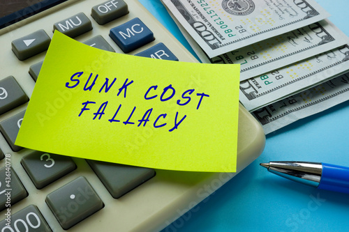 Business concept about SUNK COST FALLACY with phrase on the sheet.