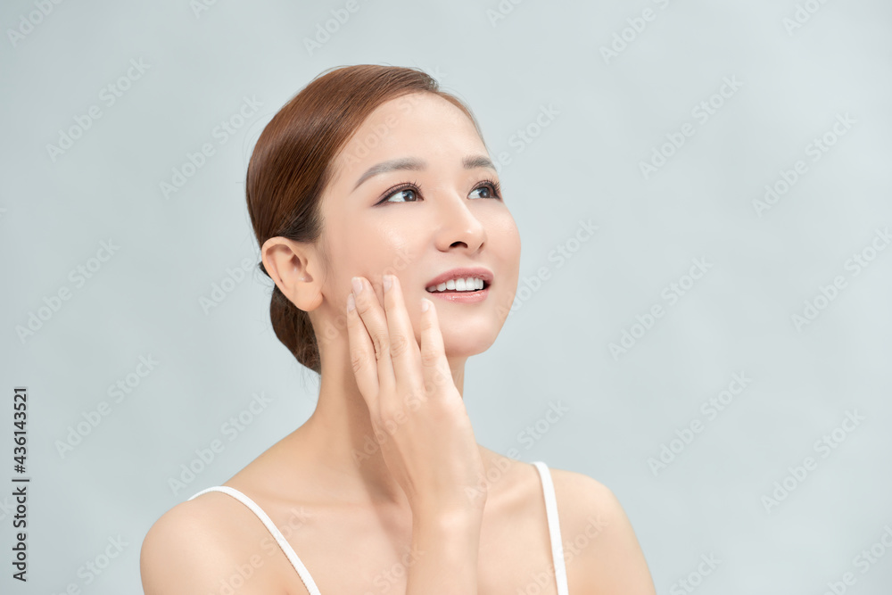 Cleansing young woman on blue background