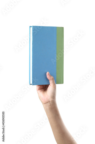 Hand holding pastel book on white background