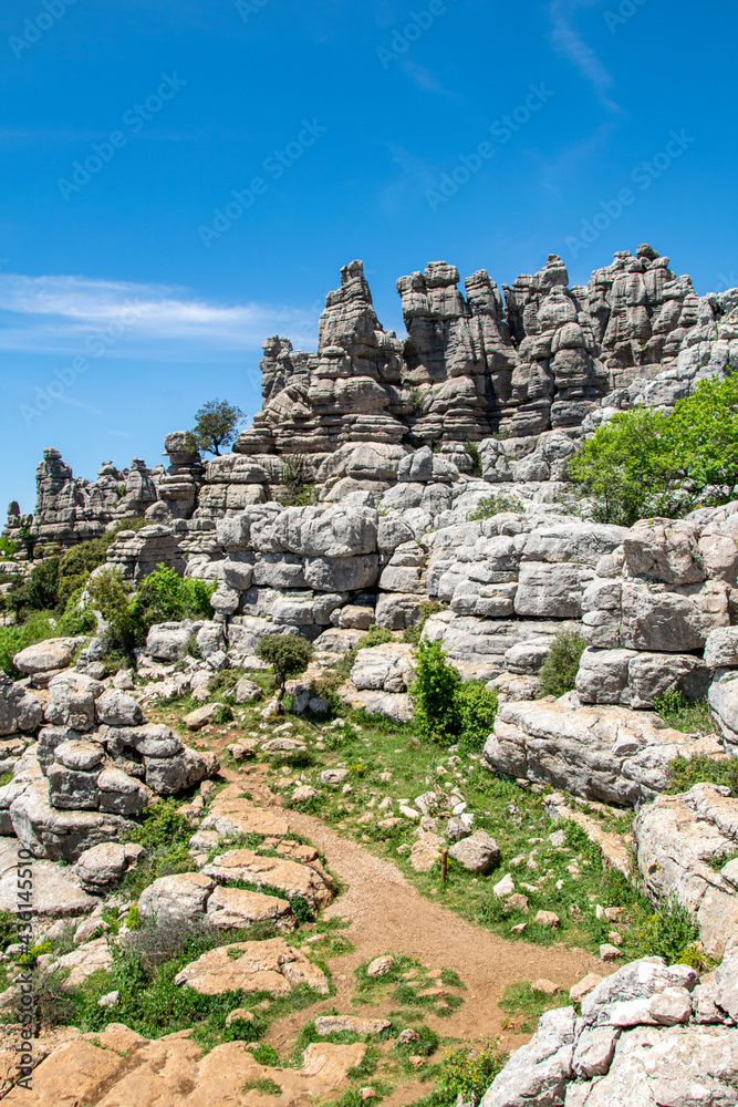 pathways through the magical weather worn peaks and valleys of Torcal in Antequera, Spain 