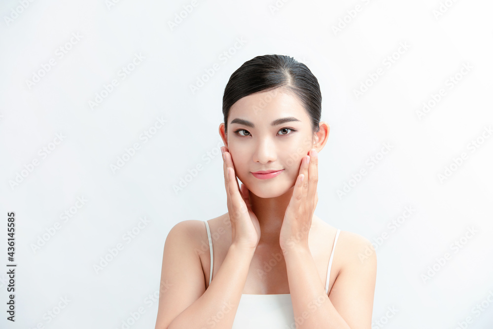 Beautiful young asian woman with clean fresh skin on white background Beautiful young asian woman with clean fresh skin on white background