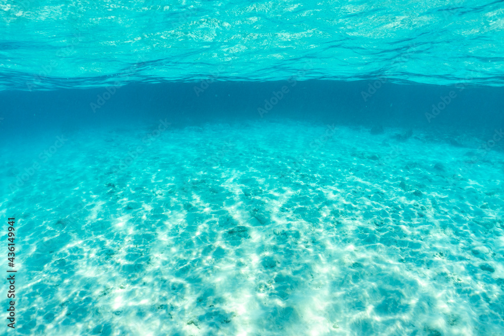 Obraz premium Underwater of tropical; sun rays passing through water.